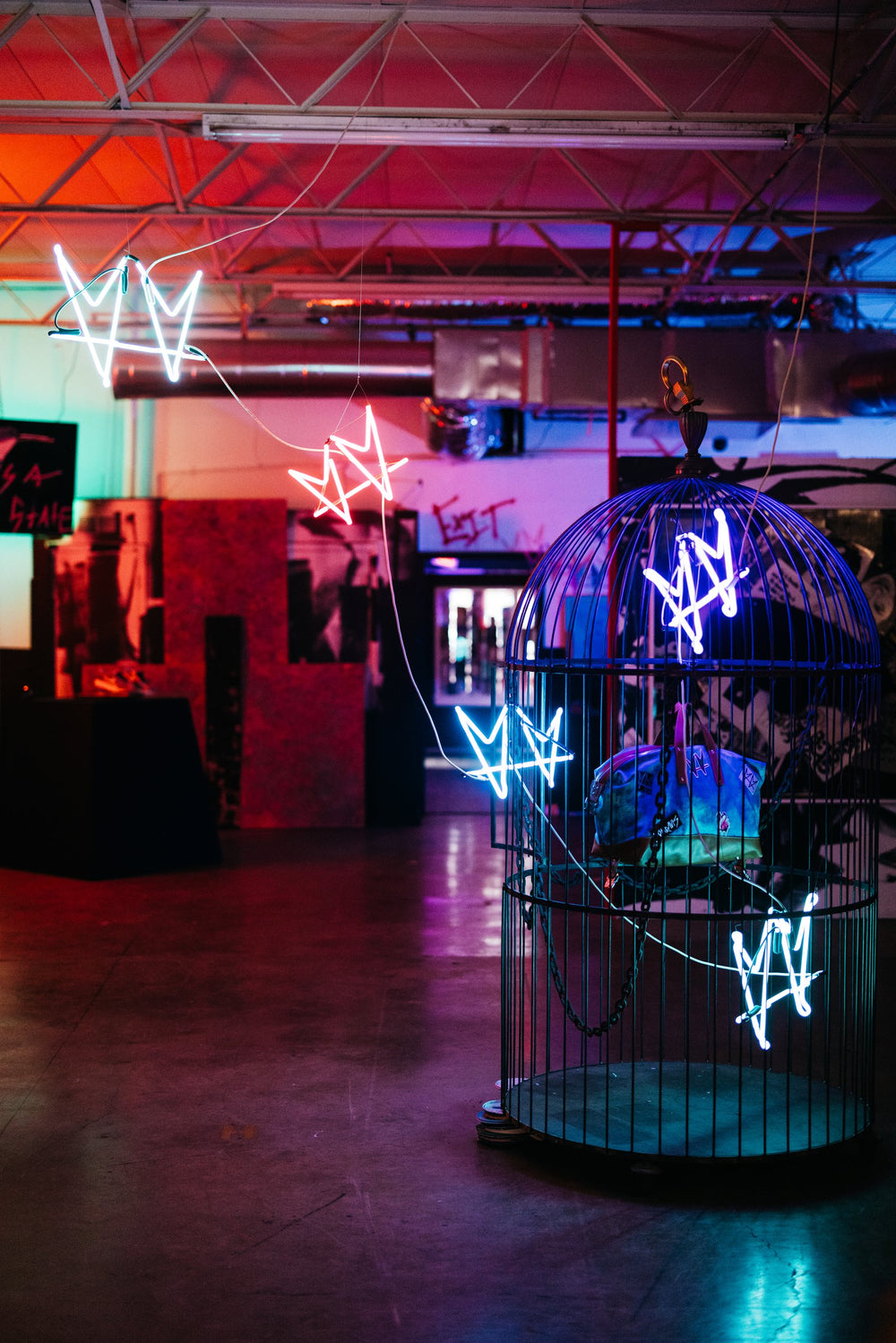 The Cage by not.travis, an installed sculpture with blue neon not.hearts