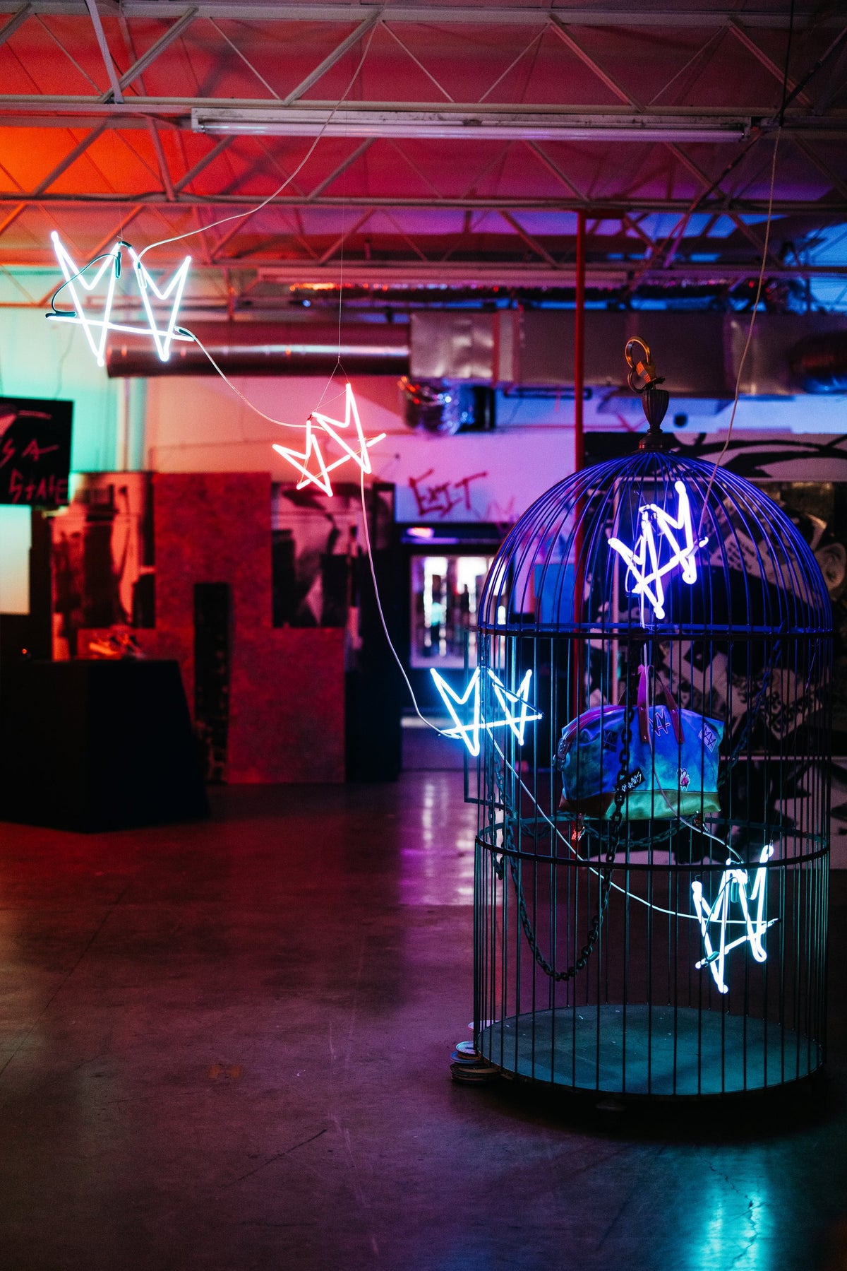 The Cage by not.travis installed in a room with illuminated crowns